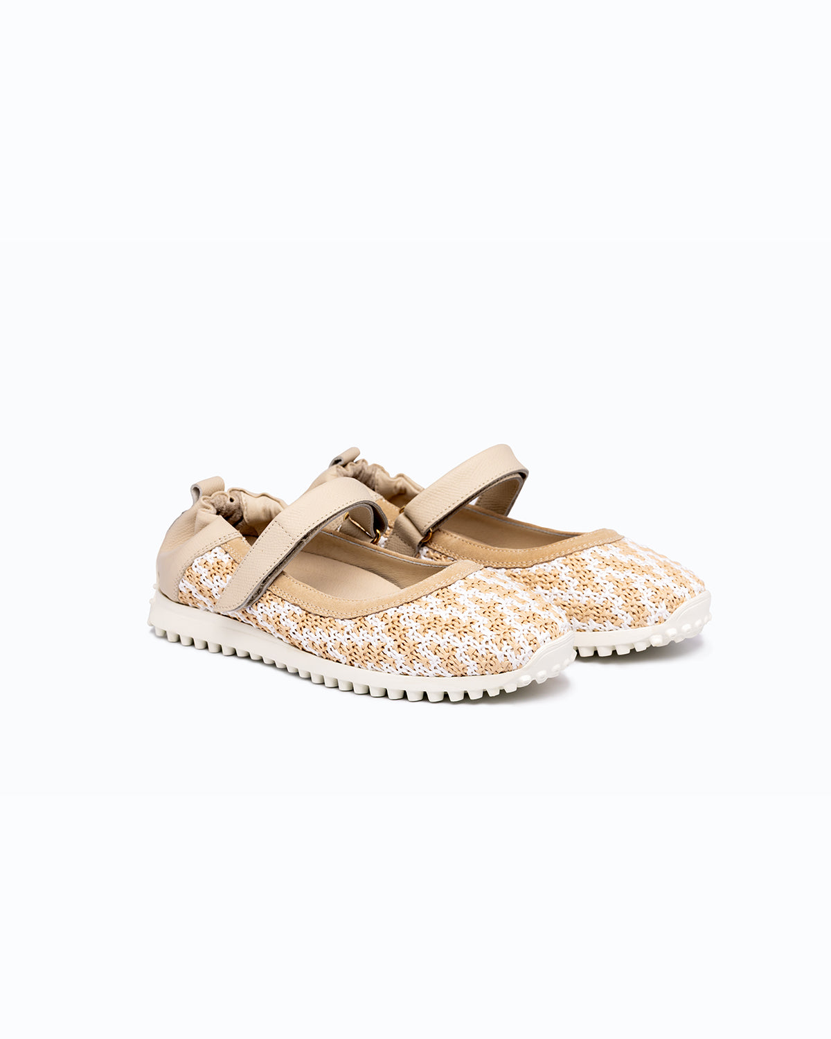 Beige, white velour and woven fabric DLS ballet flats, shown in a studio still life.
