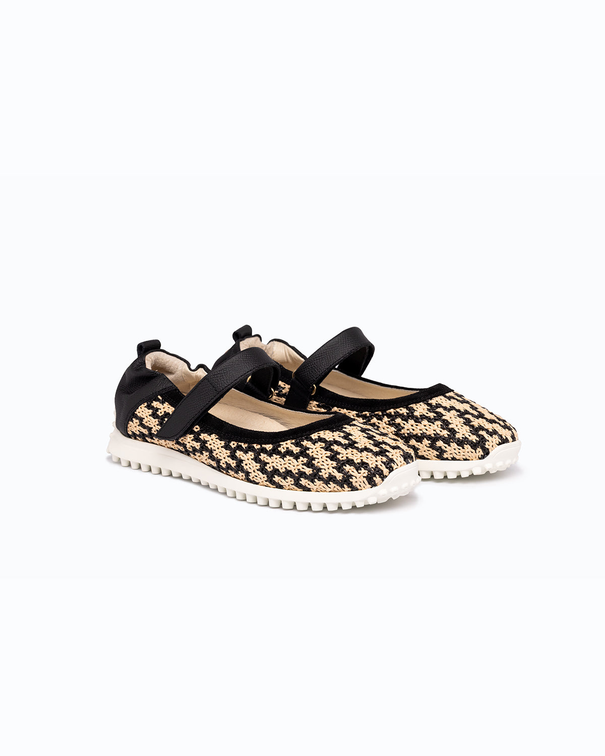 Black, beige velour and woven fabric DLS ballet flats, shown in a studio still life.