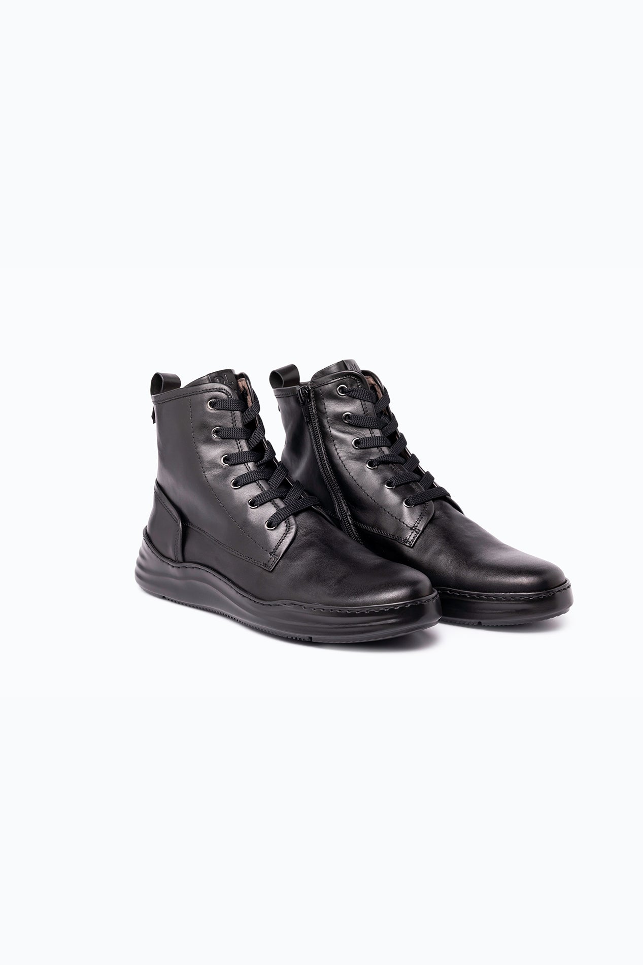 Black nappa leather DLS boots, shown in a studio still life.