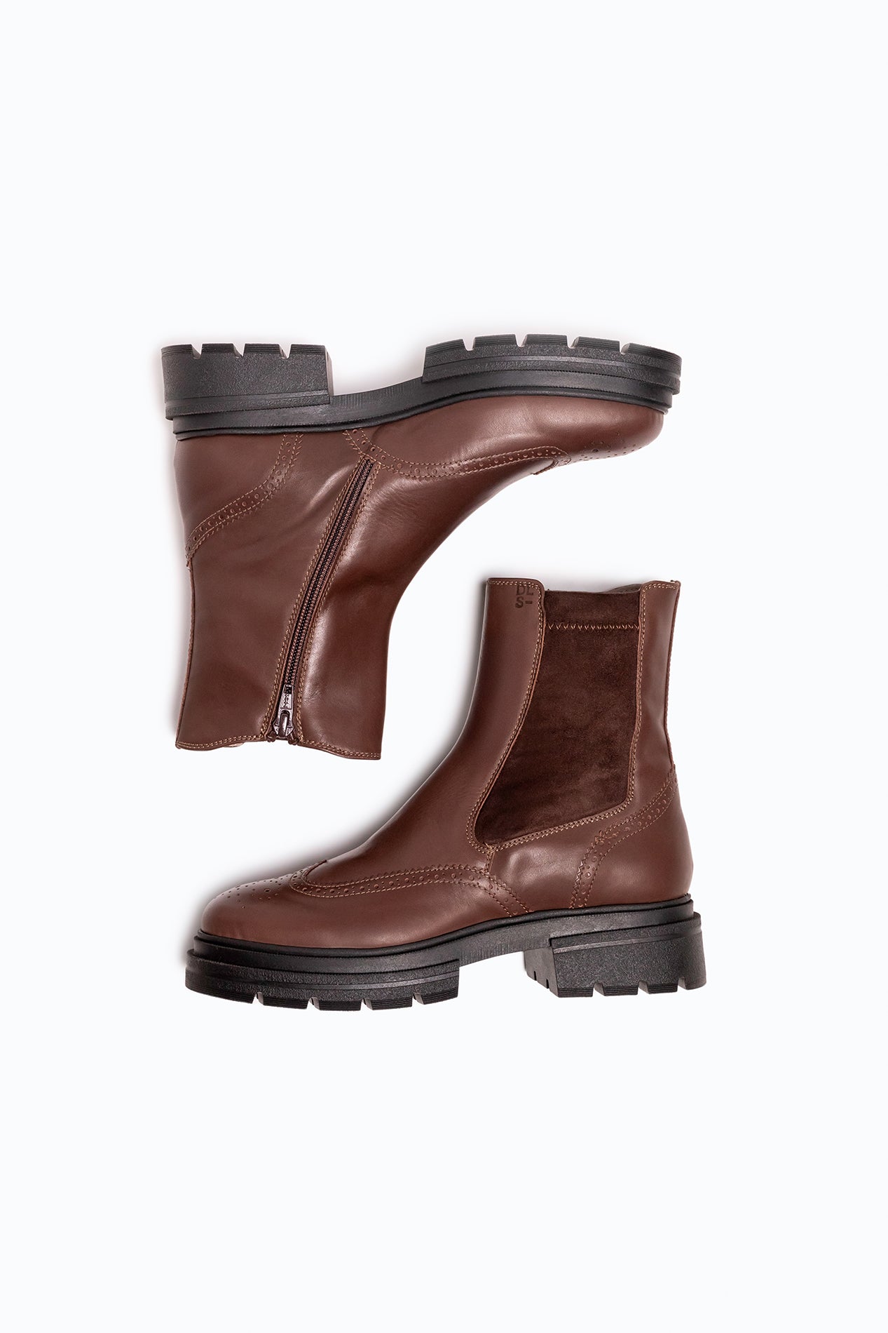 Black, brown velour DLS ankle boots, shown in a studio still life.