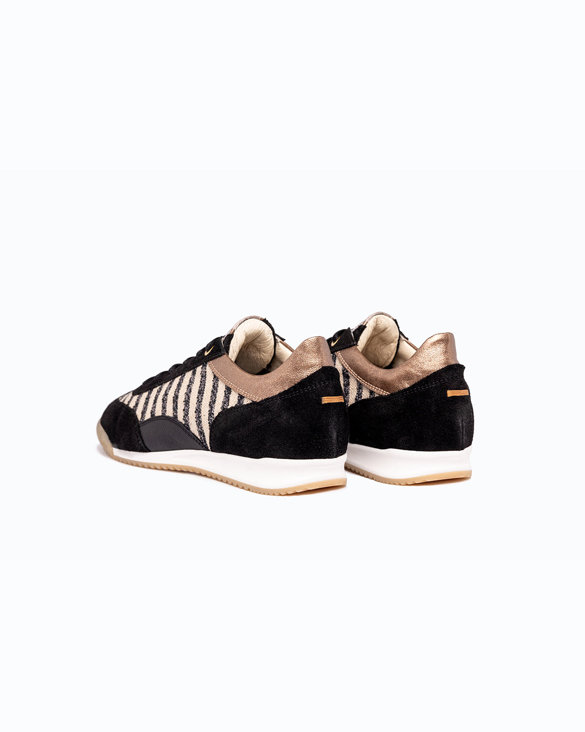 Black, bronze velour and woven fabric DLS sneakers with side zip, shown in a studio still life.