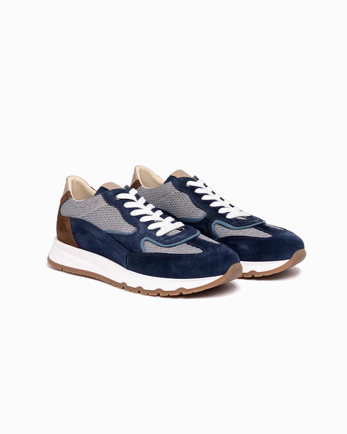 Navy, brown, grey velour DLS sneakers, shown in a studio still life.