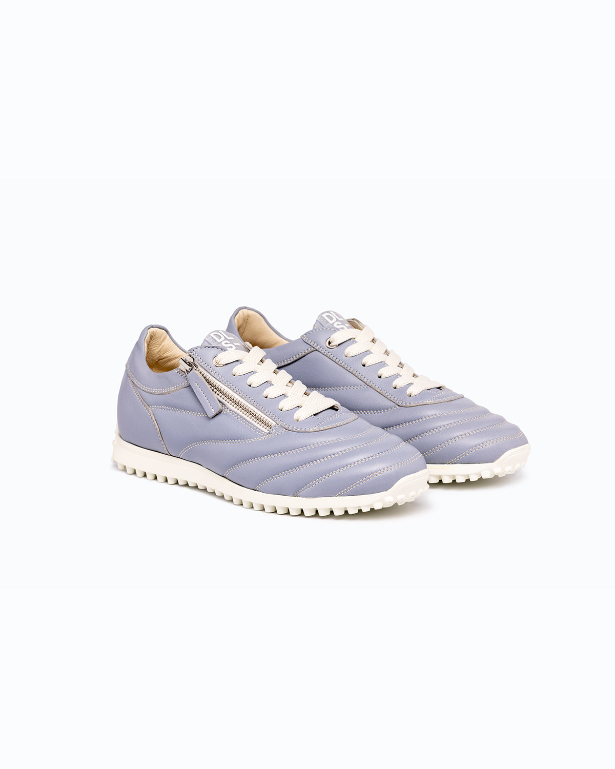 Sky blue DLS sneakers, shown in a studio still life.