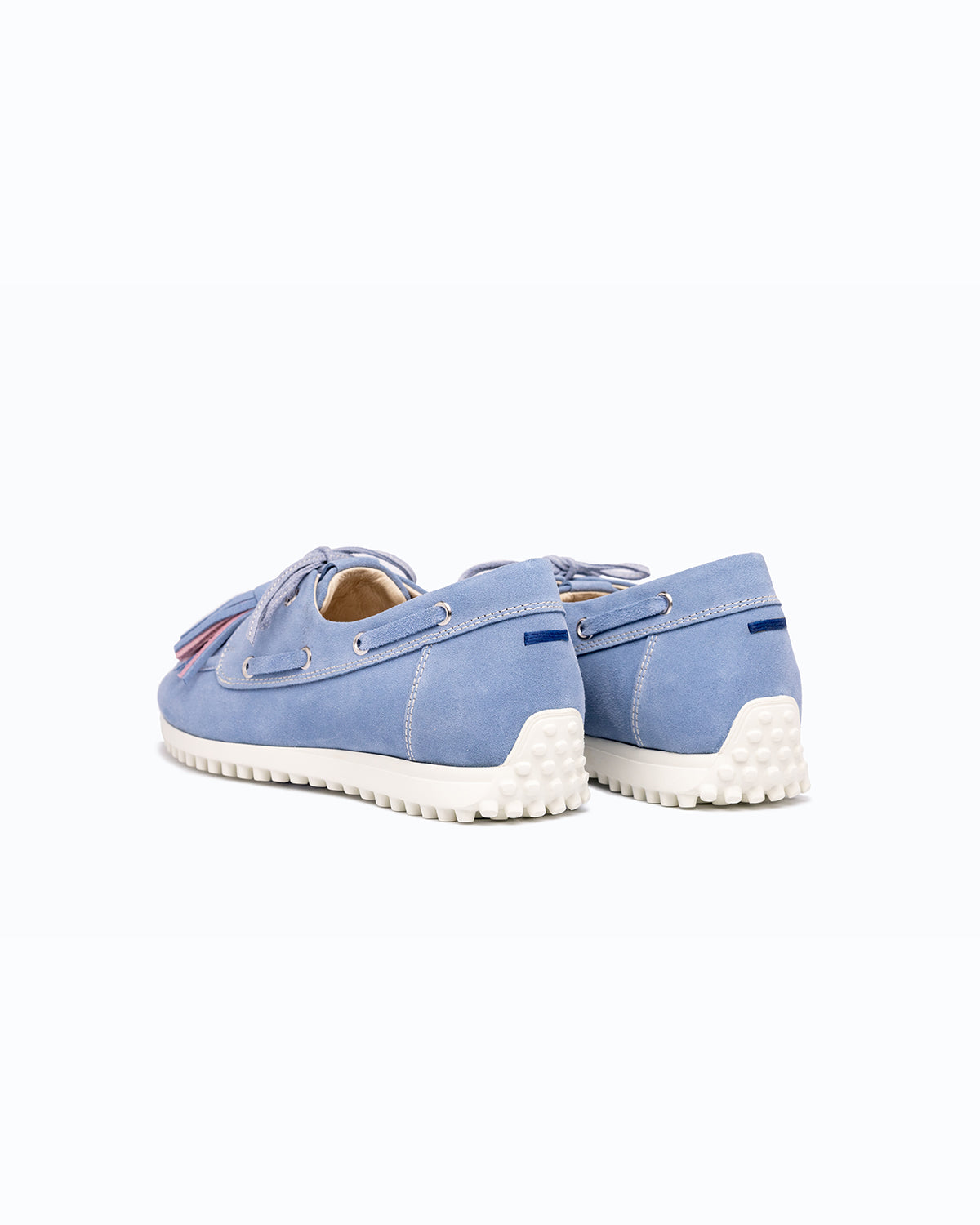 Sky blue, pink, blue velour DLS boat shoes, shown in a studio still life.