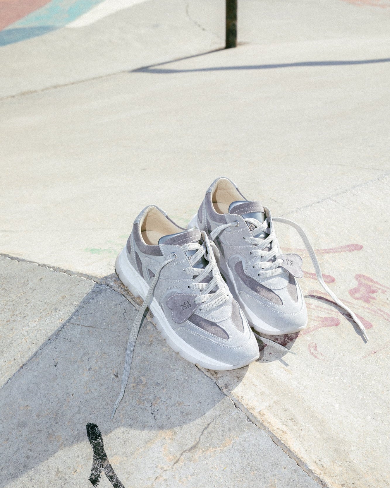 Dove grey velour Re-Novo fashion sneakers, worn in a lifestyle editorial shot.