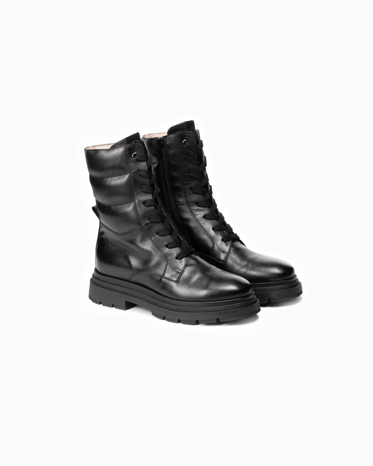 Black DLS boots, shown in a studio still life.
