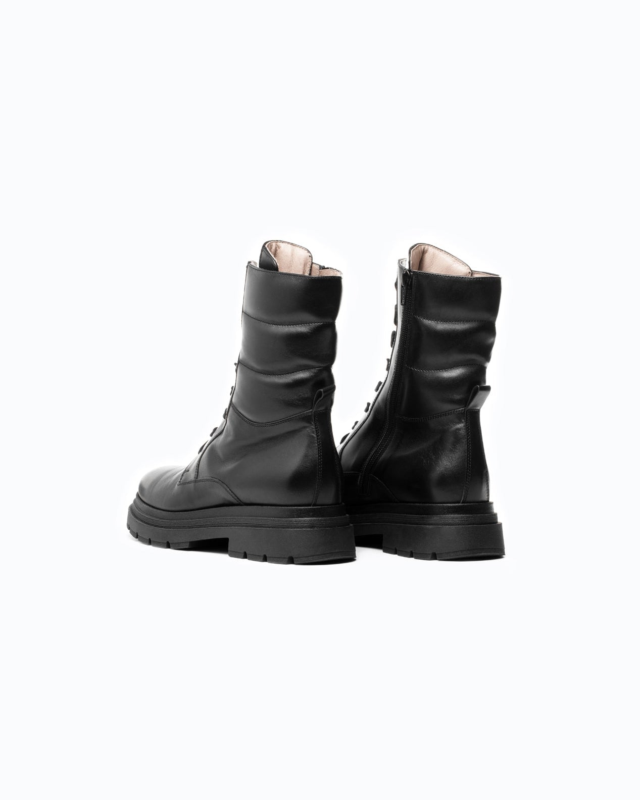 Black DLS boots, shown in a studio still life.