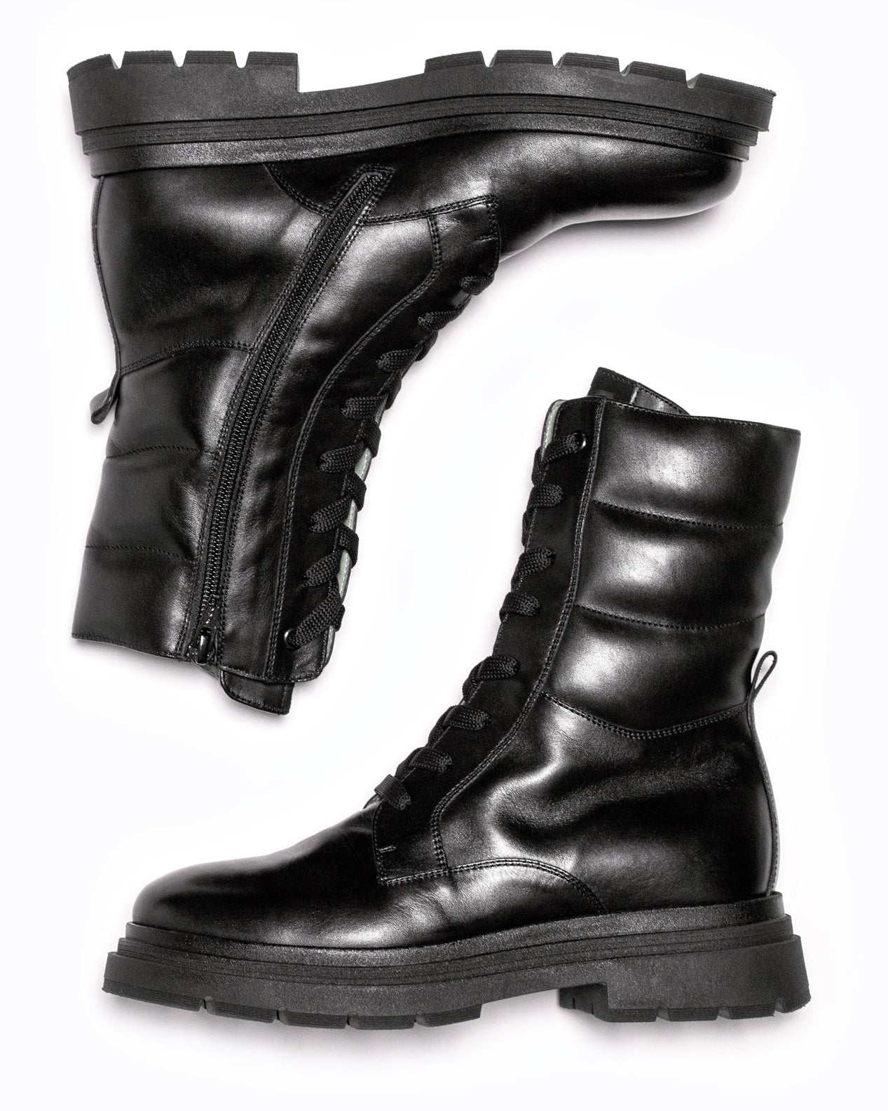 Black DLS boots, shown in a studio still life.