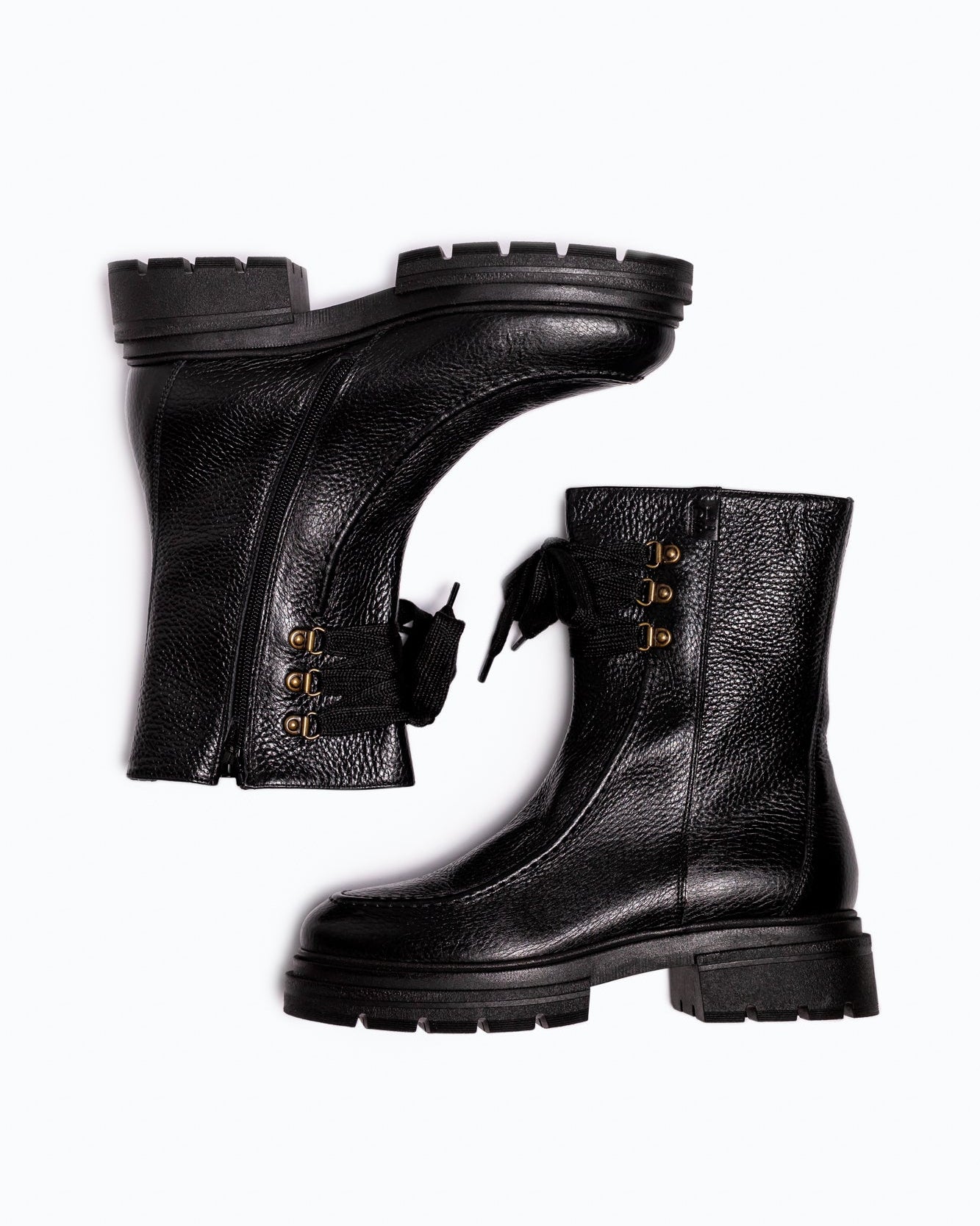 Black nappa leather DLS ankle boots, shown in a studio still life.