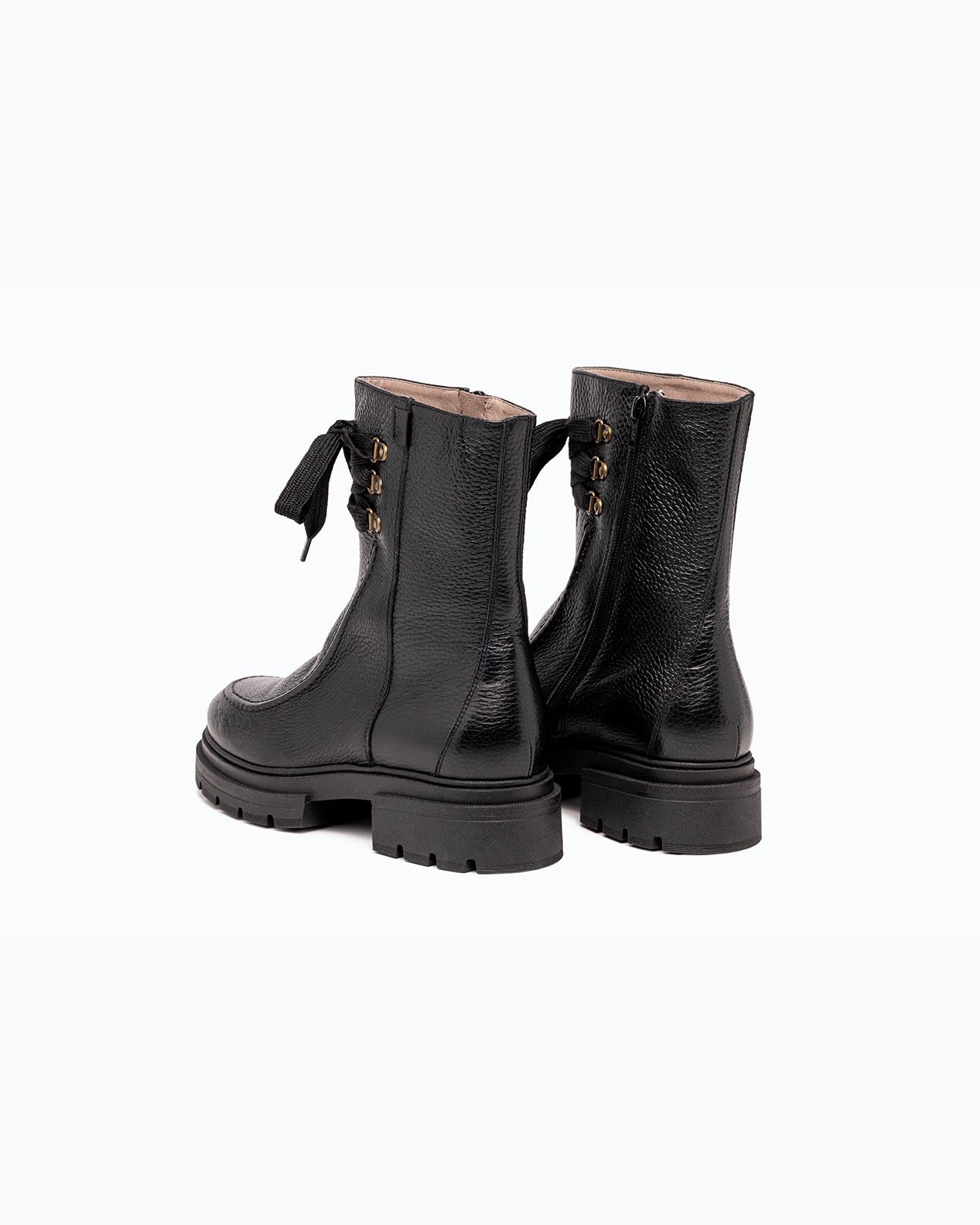 Black nappa leather DLS ankle boots, shown in a studio still life.