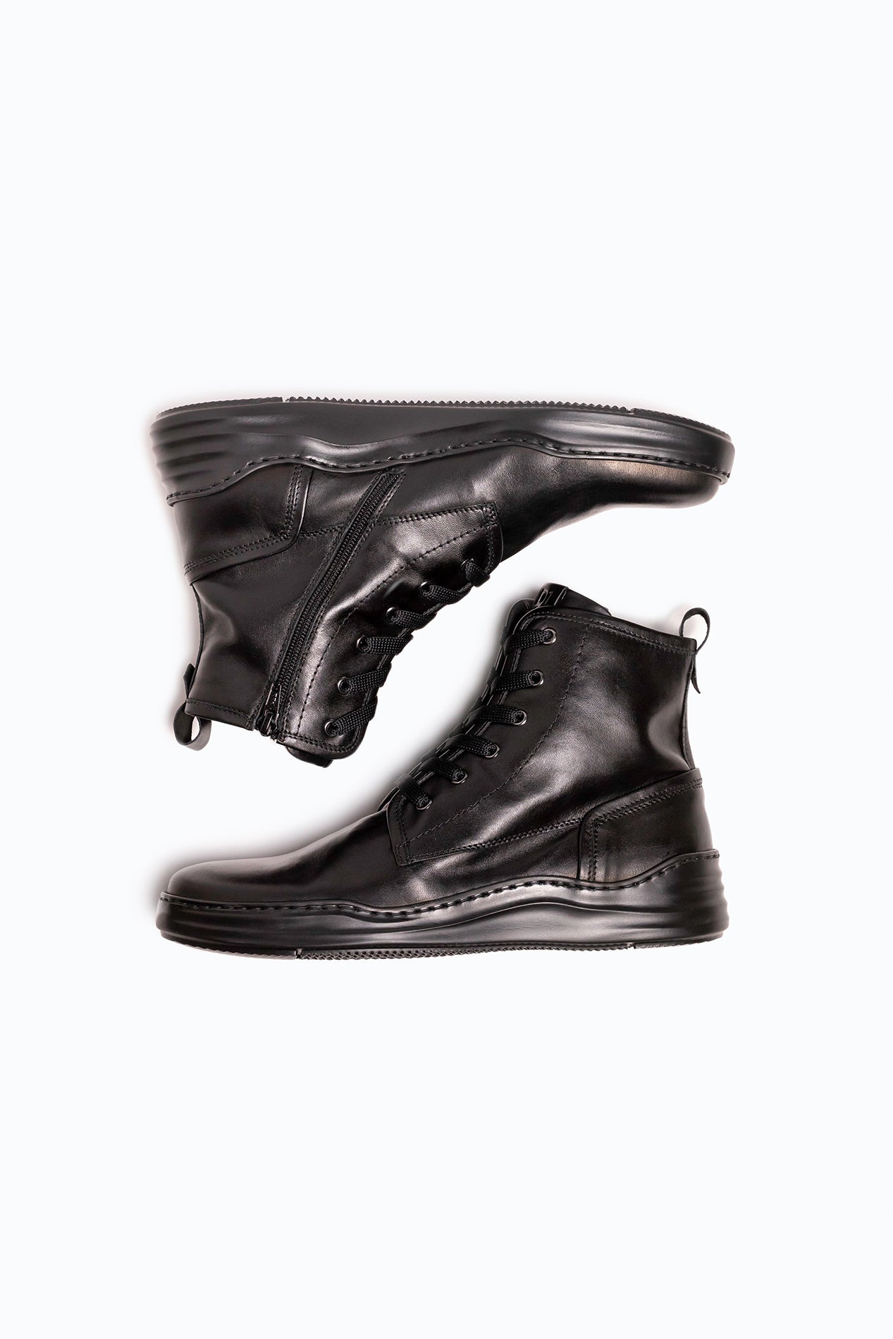 Black nappa leather DLS boots, shown in a studio still life.