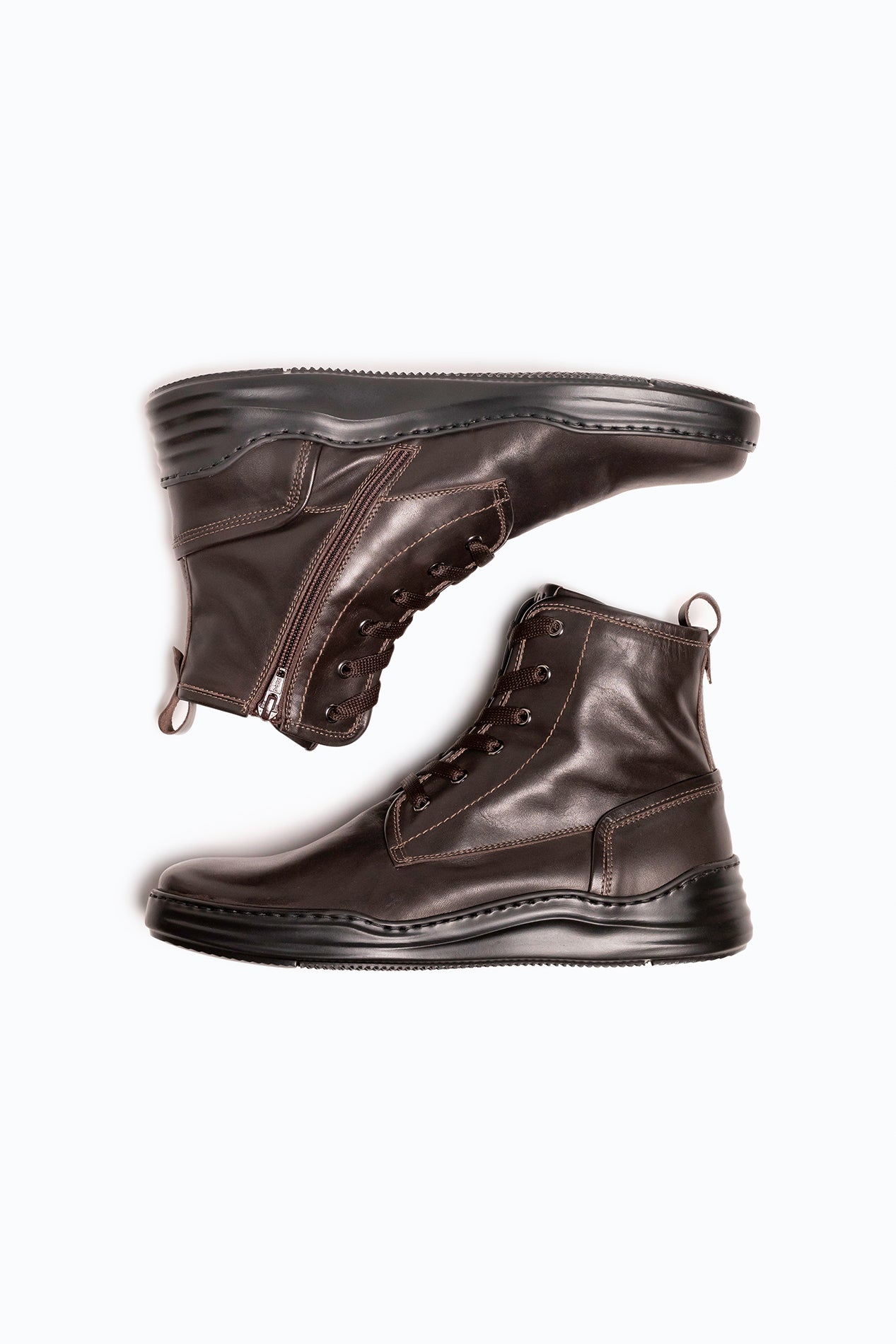 Brown nappa leather DLS boots, shown in a studio still life.