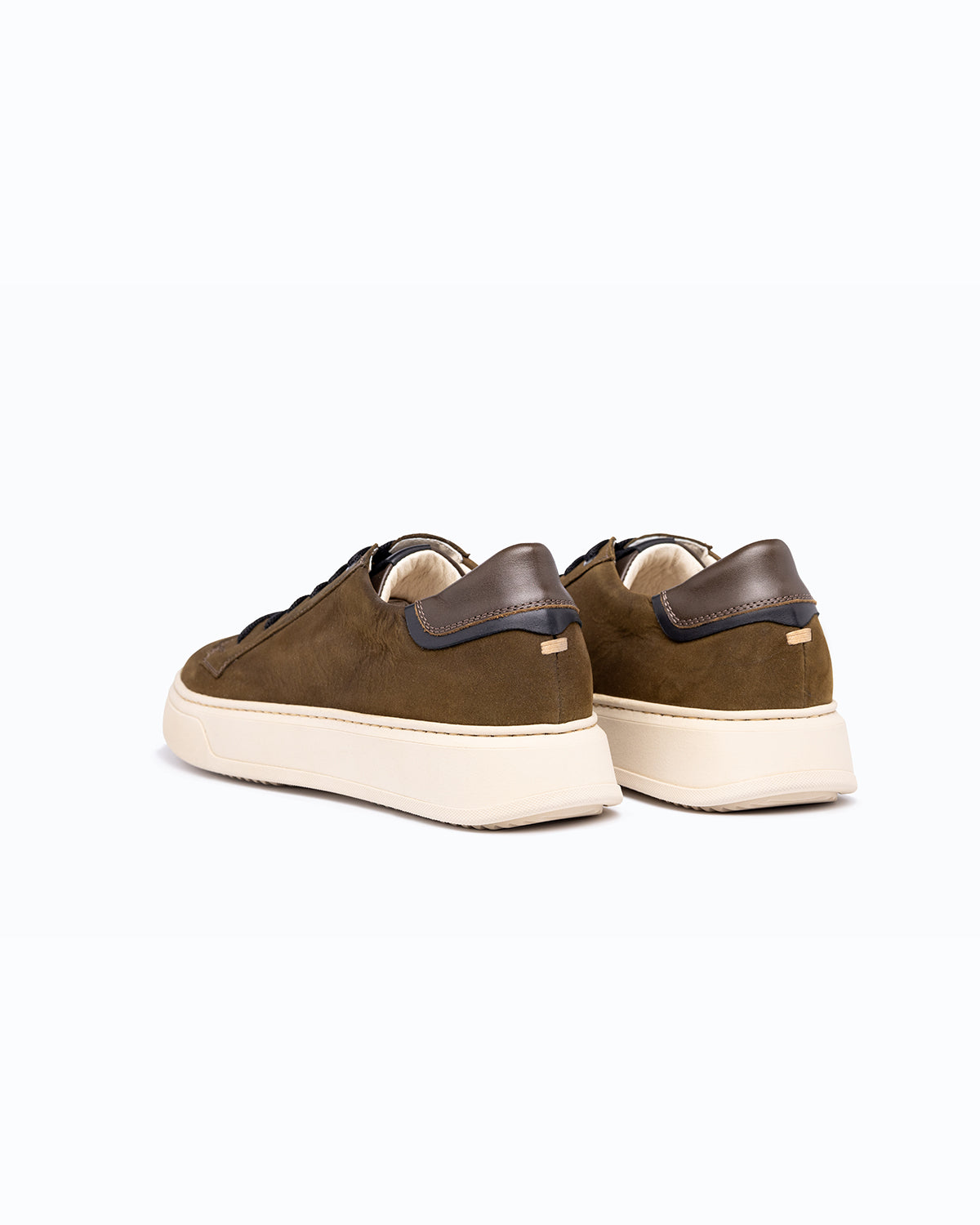Black, brown nubuck and nappa leather DLS sneakers, shown in a studio still life.
