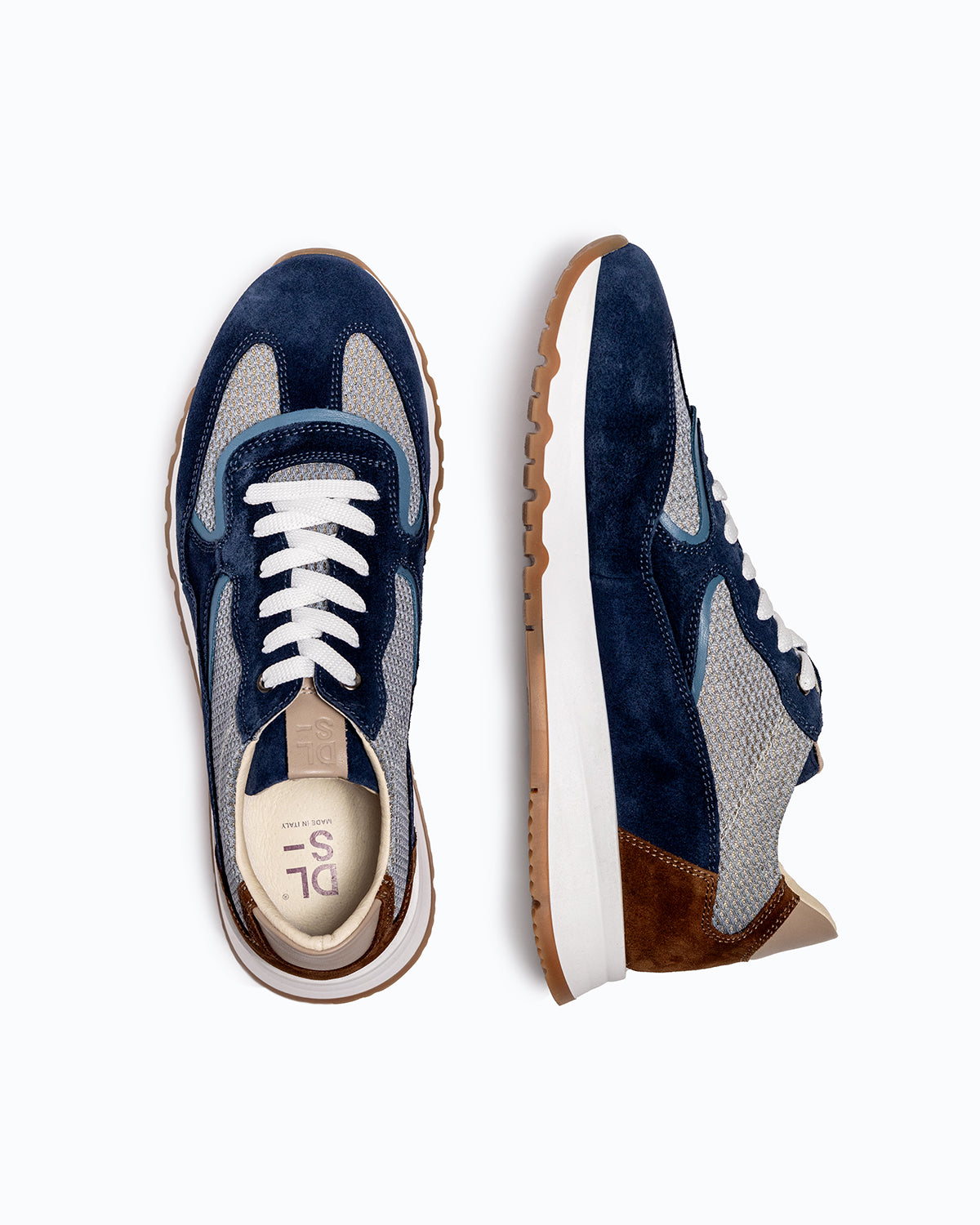 Navy, brown, grey velour DLS sneakers, shown in a studio still life.