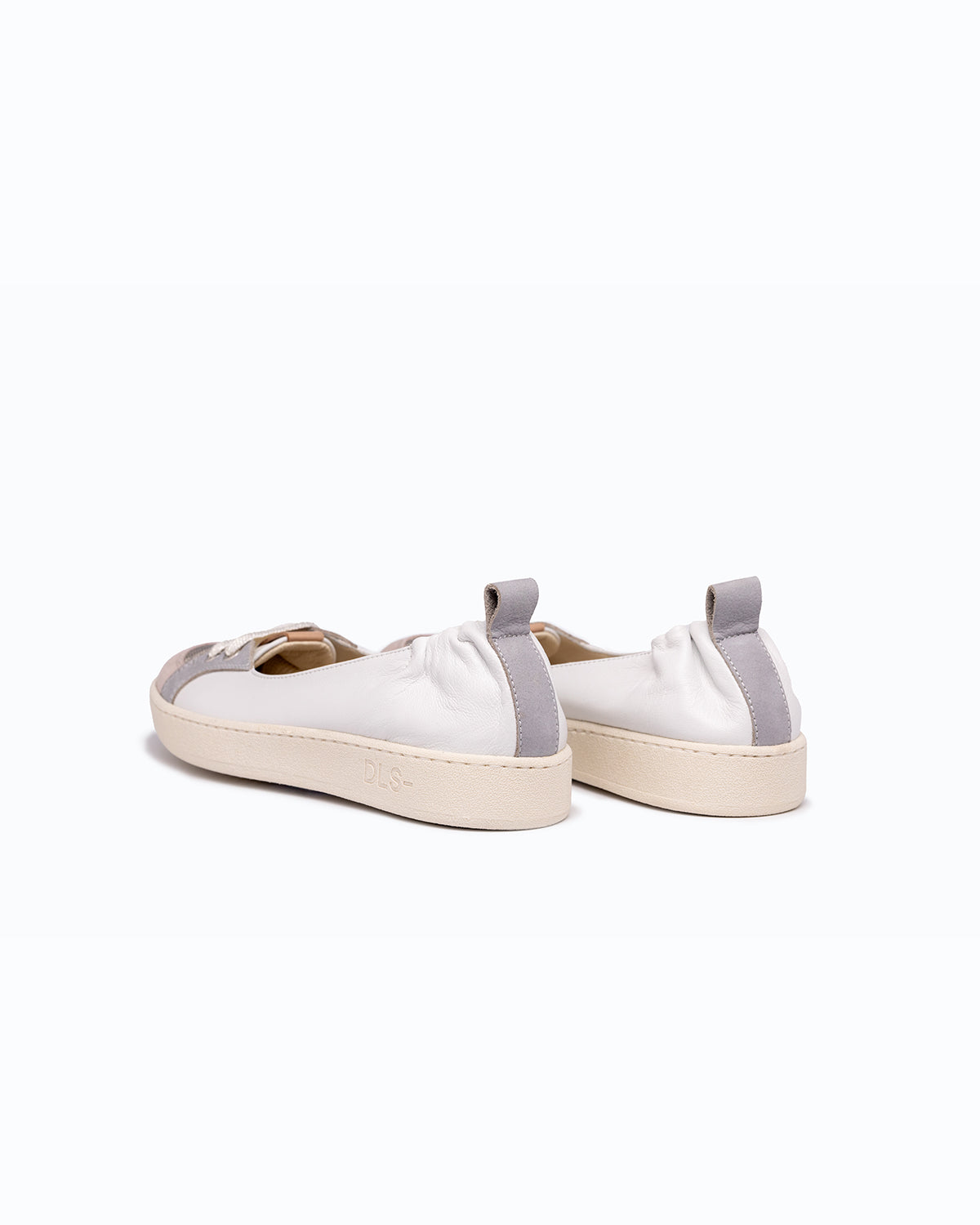 White, blue, pink nappa leather and velour DLS ballet flats, shown in a studio still life.