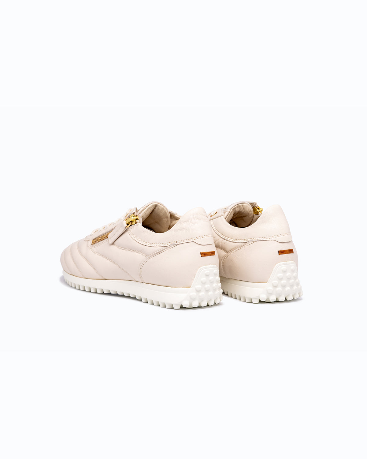 Off-white DLS sneakers, shown in a studio still life.