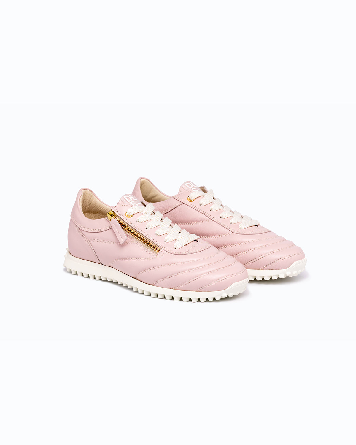 Pink DLS sneakers, shown in a studio still life.