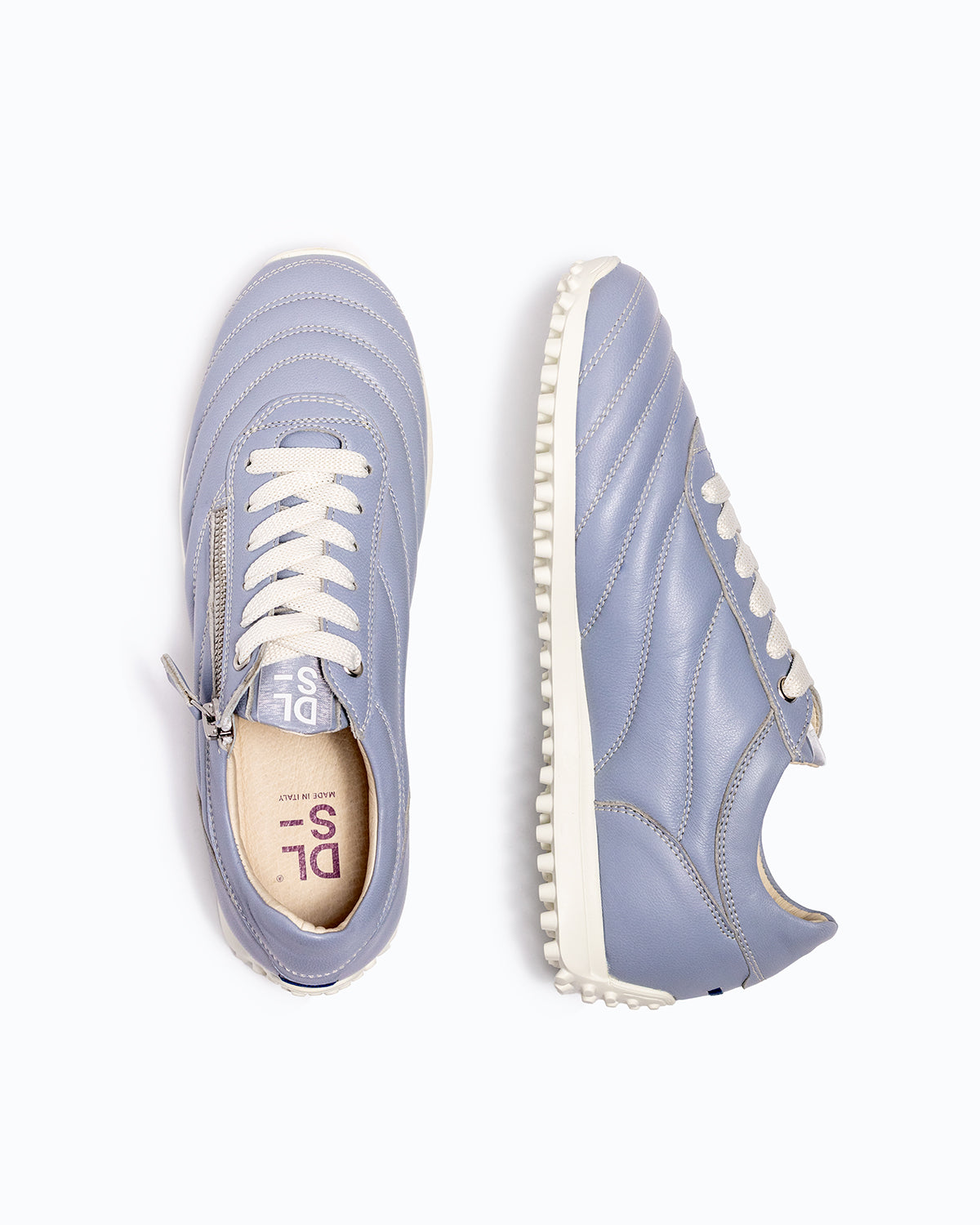 Sky blue DLS sneakers, shown in a studio still life.