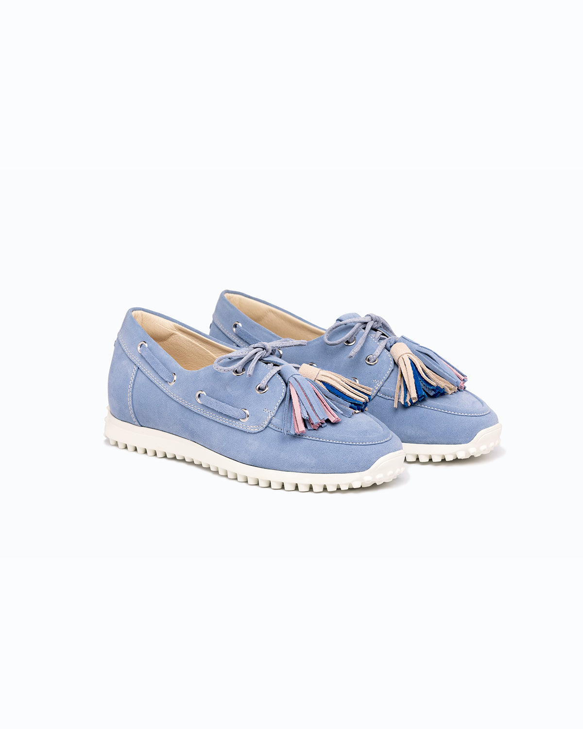 Sky blue, pink, blue velour DLS boat shoes, shown in a studio still life.