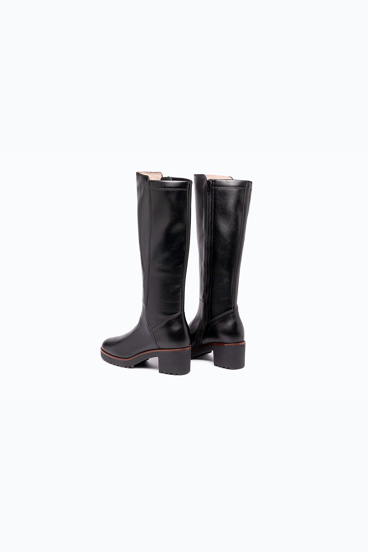 Black, brown DLS heeled boots, shown in a studio still life.