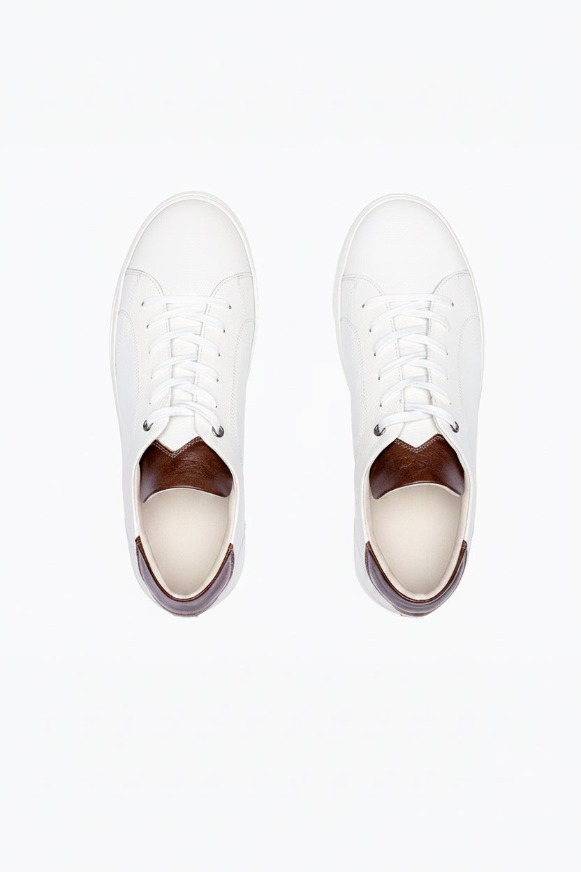 White, brown DLS sneakers, shown in a studio still life.