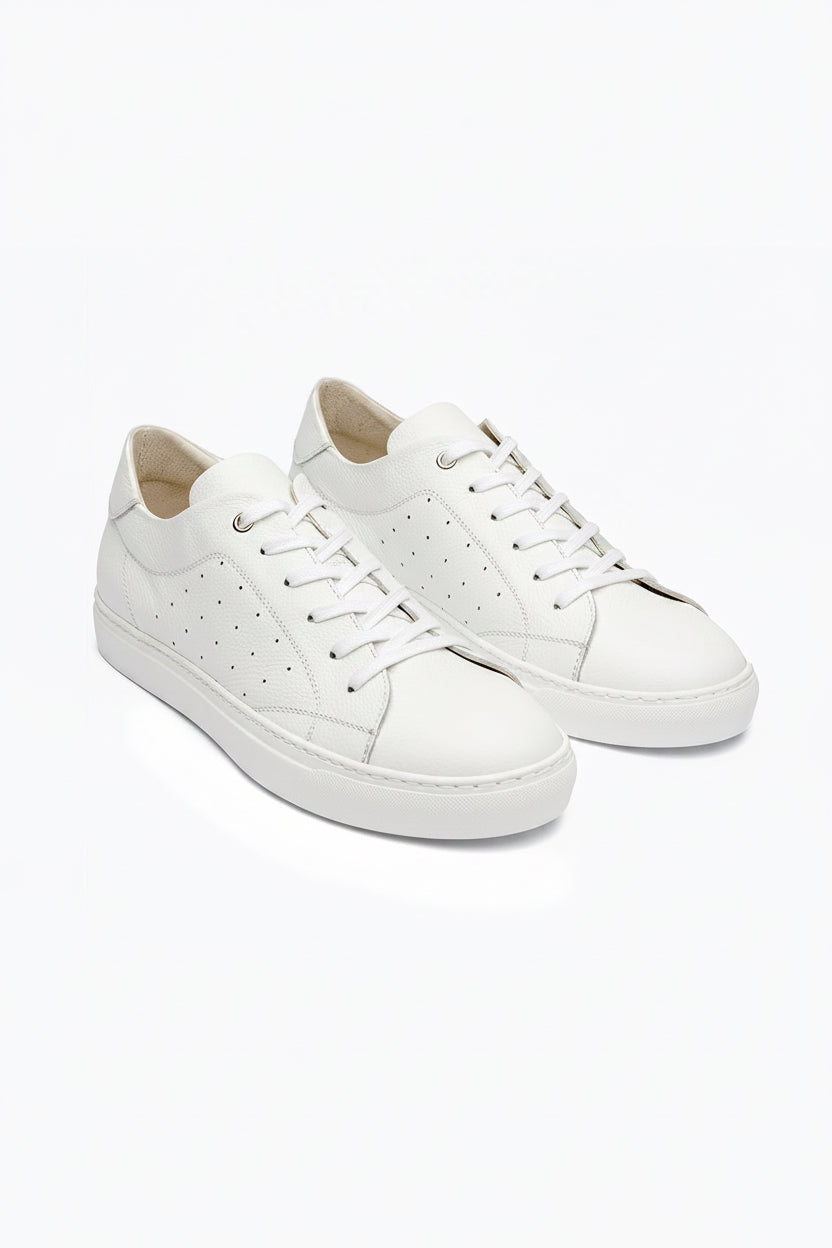 White DLS sneakers, shown in a studio still life.