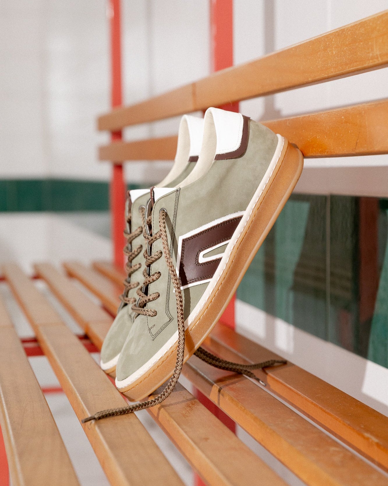 Military green, green, ivory nubuck and leather Re-Novo leather sneakers, photographed on location in a lifestyle scene.