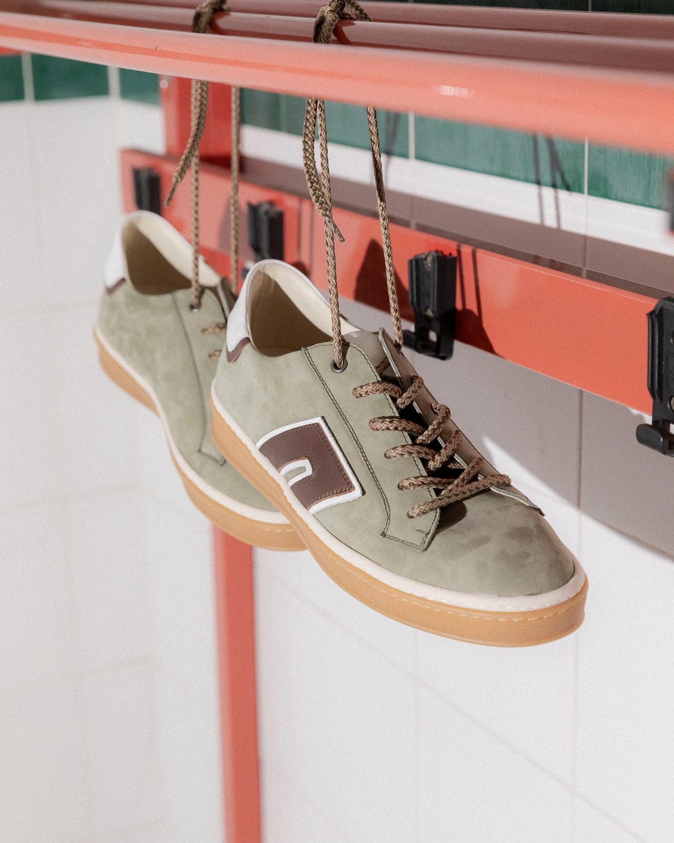 Khaki, olive green, off-white nubuck and leather Re-Novo trainers, captured in an outdoor lifestyle scene.